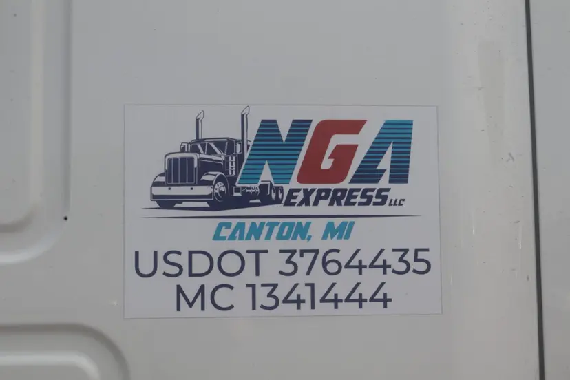 Close view of NGA Express truck branding and carrier credentials on company equipment.